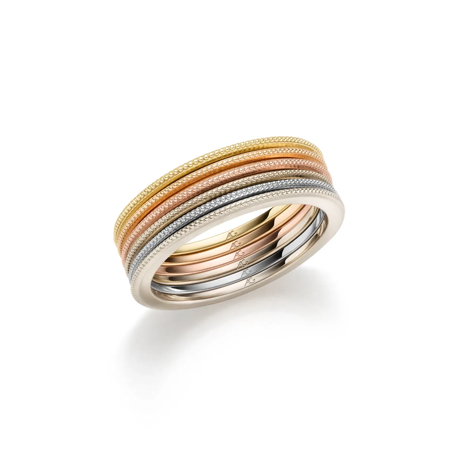 Sechs schmale Fingeringe in unterschiedlichen Goldfarben nebeneinander.