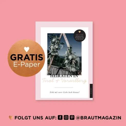 Cover des E-Papers Heiraten in Tirol & Vorarlberg mit einer alpinen Blumendeko vor Bergkulisse – Tipps für Hochzeiten in den Alpen.