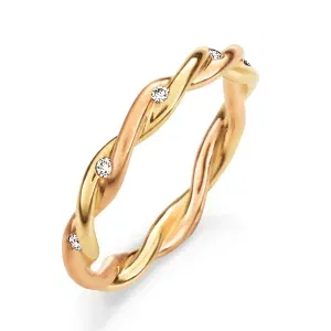 Zweifarbiger, gedrehter Goldring mit Diamantbesatz als eleganter Antragsring.